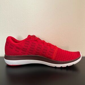 Brand new men’s red Under Armour tennis shoes.
